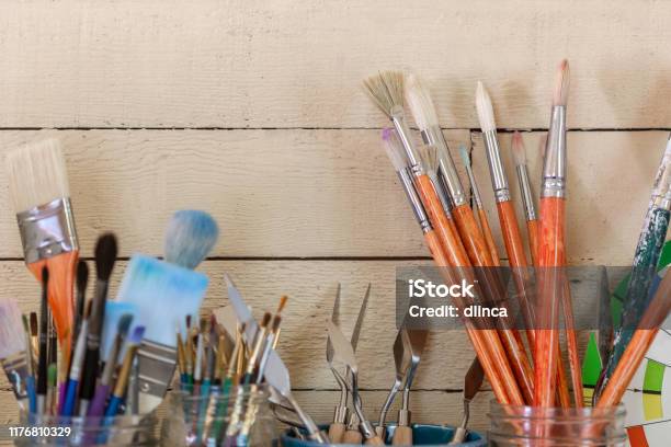 Art Paint Brushes In Jars Palette Knifes Art Supplies In Artists Studio  With Shiplap Wall Copy, Art Paint Brushes