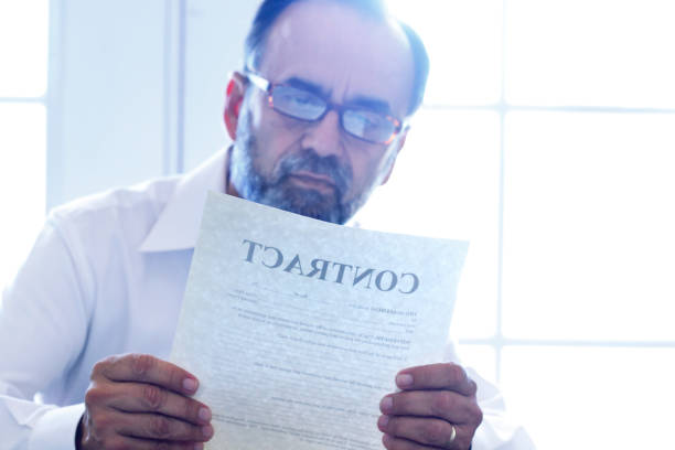 istock Hispanic Man Reviewing A Contract 1176810610