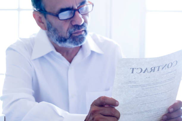 istock Hispanic Man Reviewing A Contract 1176810613