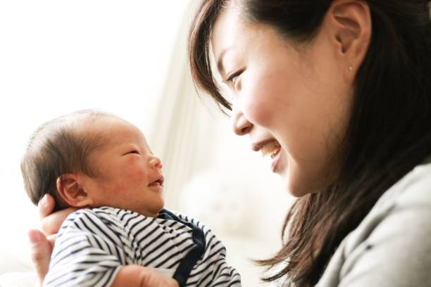 Newborn baby and mother Asian mother is smiling with 8-days old her baby babyhood photos stock pictures, royalty-free photos & images