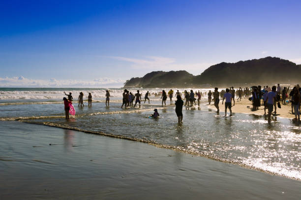 People playing at the seaside in Japan stock photo