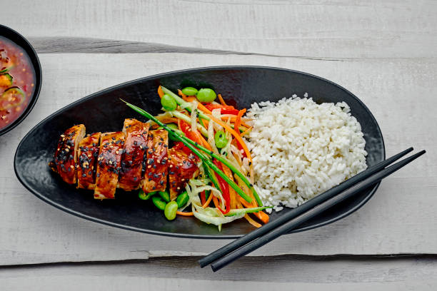 istock Teriyaki chicken with salad and rice 1176812269