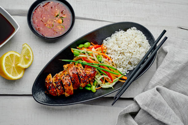 istock Teriyaki chicken with salad and rice 1176812643