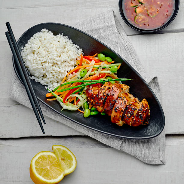 istock Teriyaki chicken with salad and rice 1176813933