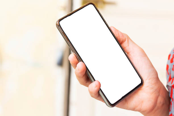 istock Female hand holding black cellphone 1176814085