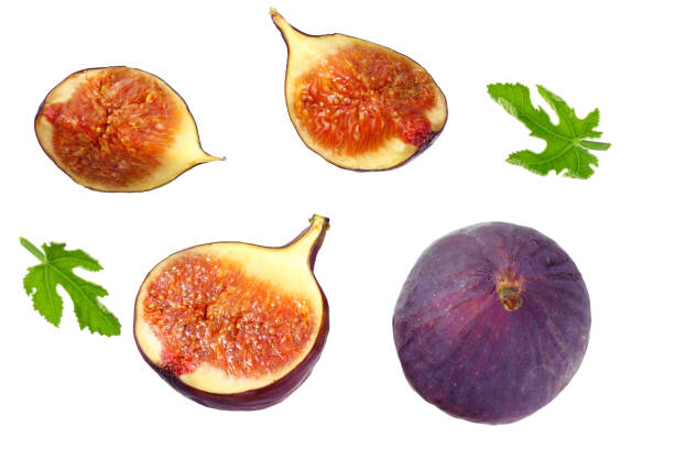 istock Fig fruit with green leaf and slices isolated on white background Top view 1176814196