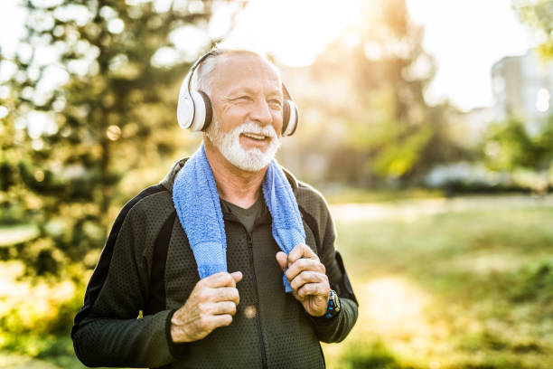 istock Dedicated sporty senior man resting from exercise outdoors. 1176815086