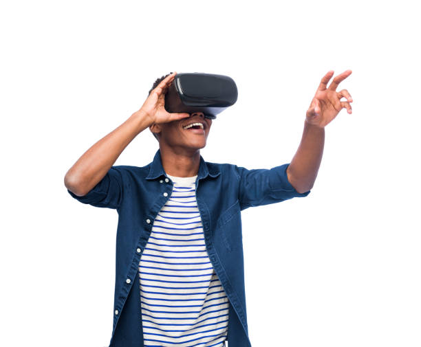 University student with a virtual reality headset Modern, University Student, Afro-Caribbean Ethnicity, Smiling virtual reality simulator photos stock pictures, royalty-free photos & images