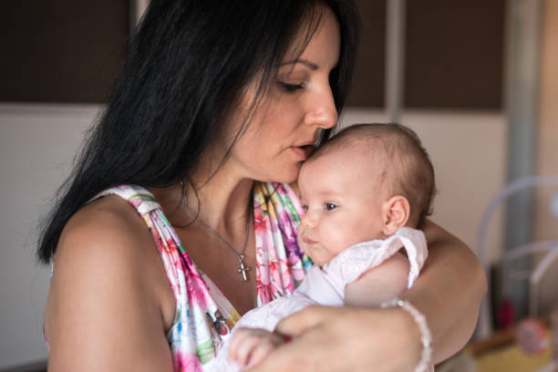 istock Mother holds newborn baby 1176817373