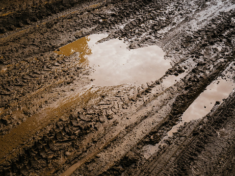 Mud and slush brown. Truck tracks. Deep, impenetrable mud. Danger of getting stuck