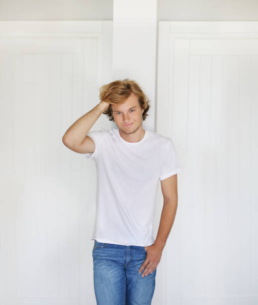 istock Teenager standing near a white wall 1176821246