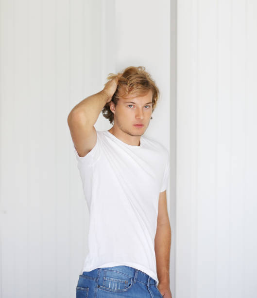 istock Teenager standing near a white wall 1176821255