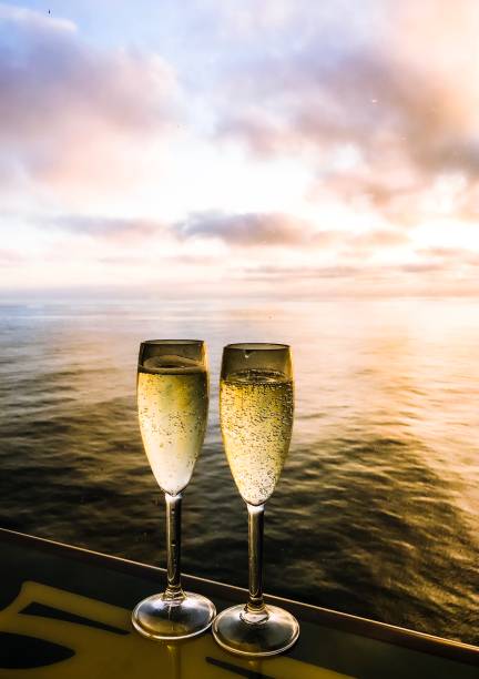 istock Two glasses of champagne in beautiful sunset light. 1176827562