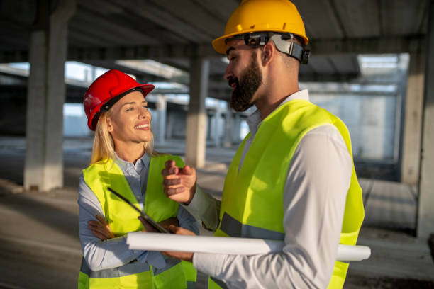 istock Group of business partners meeting on a construction site 1176829321