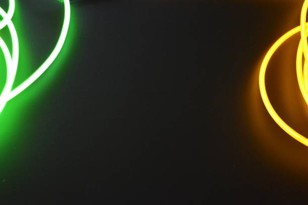 istock Bright luminous yellow and green, lime neon wires in different formats and layouts. An electroluminescent wire, a neon light guide, an ice tube are folded into different structures and shapes. 1176830702