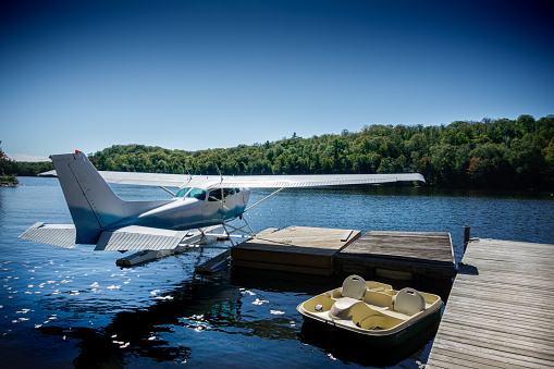 Seaplane moored at the shore of lake, Canada