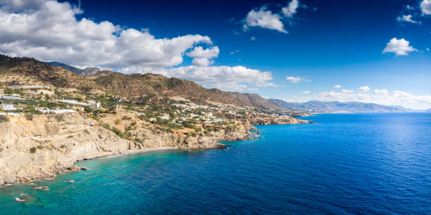 istock Seascape and mountain against sky 1176832682