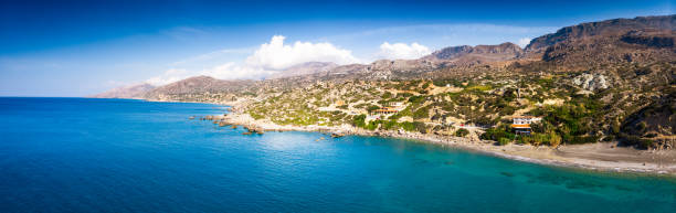 istock Seascape and mountain against sky 1176833234