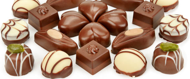 istock Assortment of chocolate candies isolated on white background. 1176834361