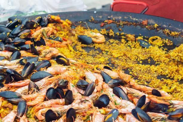istock Spanish dish paella closeup cooking 1176837776