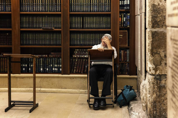 Religious Jew reading Torah in Cave Synagogue n Jerusalem, Israel. stock photo