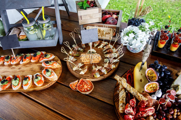istock Summer party snacks on wooden table. 1176840443