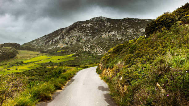 Scenic view of mountain road against sky, Crete, Greece