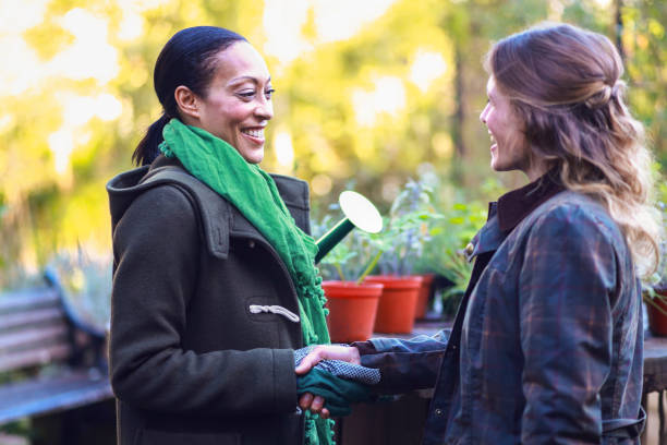 istock Female friends gardening 1176840716
