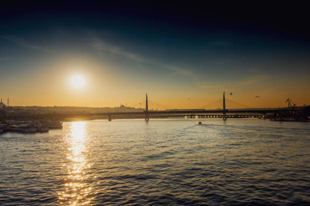 istock View of ship at harbor with bridge in the background 1176842629