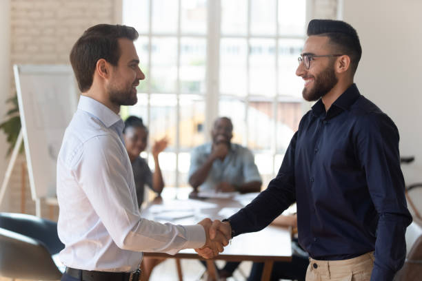istock Happy proud boss manager handshake promote congratulate successful worker 1176842770