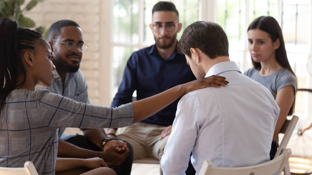 istock Rear view at upset man feel depression get psychological support 1176842783