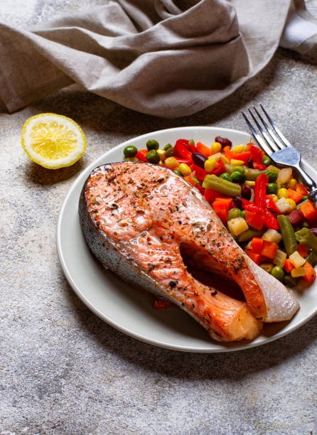 istock Baked salmon fillet with vegetables 1176845678