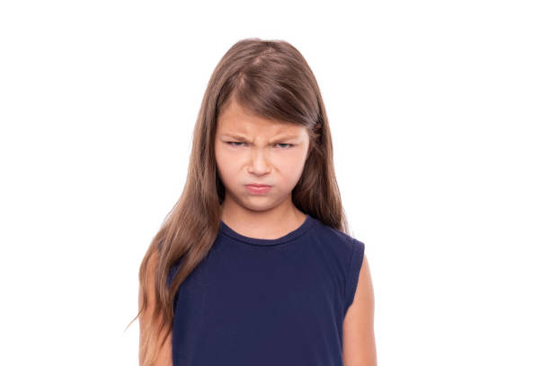 istock Angry baby girl on white background. 1176846055