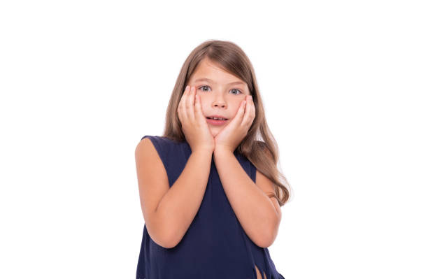 istock Little girl shows surprise on a white. 1176846100