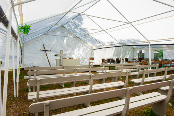 pulpit, cross and benches at a tent revival. - revival imagens e fotografias de stock