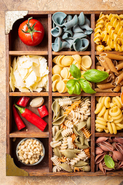 istock Assorted colorful italian pasta in wooden box 1176846909