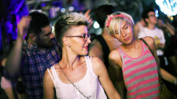 istock Two ladies dancing at concert 1176847243