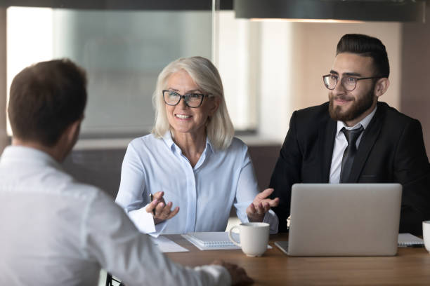 istock Smiling hr managers holding interview with good job applicant 1176848583