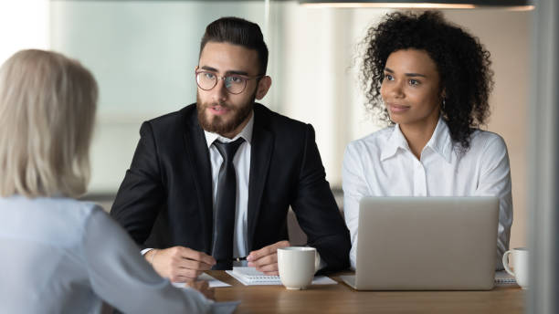 istock Two diverse hr managers holding job interview with mature applicant 1176848588