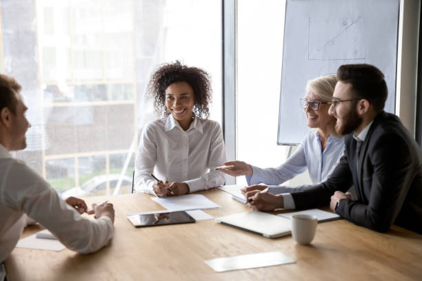 istock Diverse business partners discussing ideas at group negotiations 1176848626