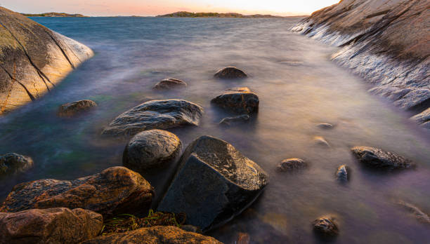 istock A small rocky bay by the sea at night. 1176850094