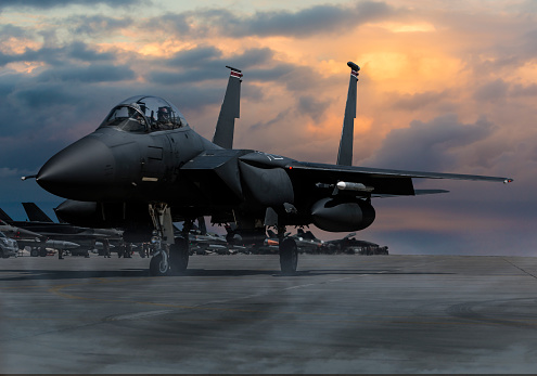 military jet aircraft parked on runway in sunset .3d render and illustration.