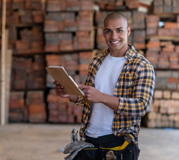 istock Happy man working at a wood factory 1176857322