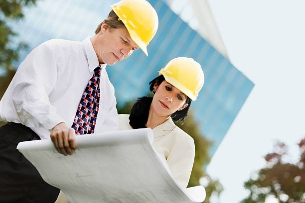 istock Young Professionals  Wearing Hardhats 117686122