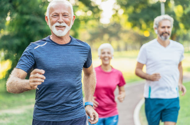 istock Senior athletes jogging in the park 1176861457