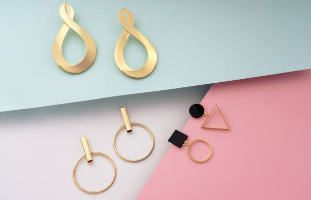 istock Golden modern stud geometric earrings on colorful background 1176863417
