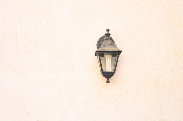 istock the old wall street lamp on textured background 1176864724