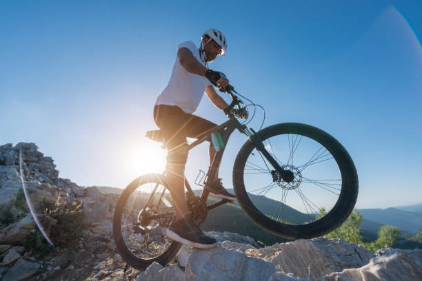 istock Mountain Biker Riding on a rocky hillside 1176865603