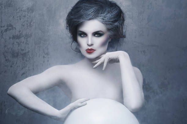 istock Woman with creative makeup and body-art 1176866075