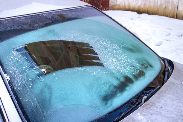 istock cleared the frost on the windshield in the cold, front and rear blurring the background 1176868726